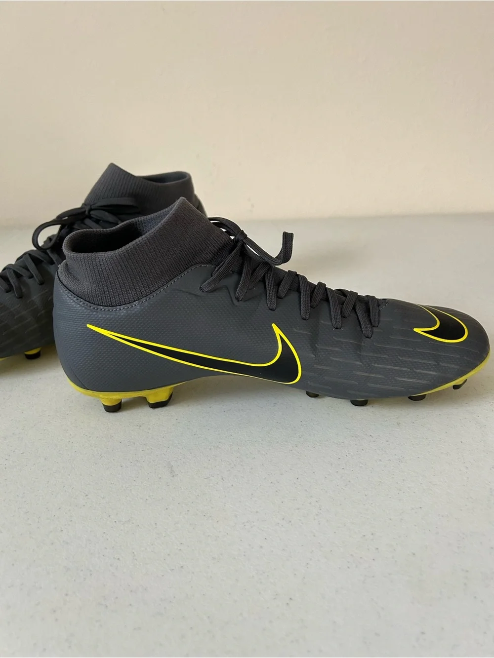 Nike Men’s Black Soccer Cleats with Yellow Swoosh